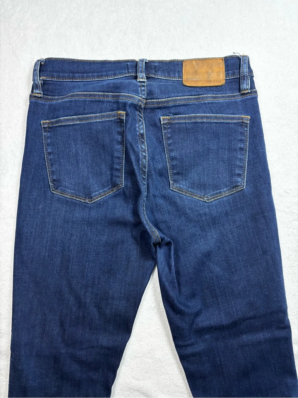 J.Crew jeans, Women’s high‑rise skinny size 27, dark wash, stretchy and sleek.